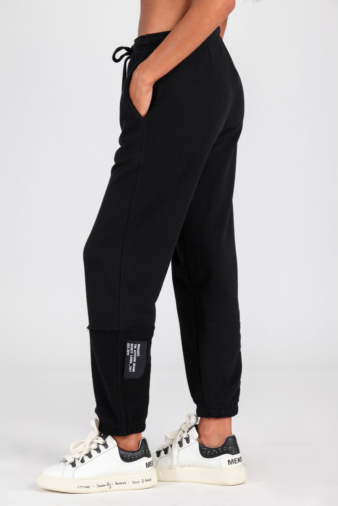 Jogger cortes desiguales negro