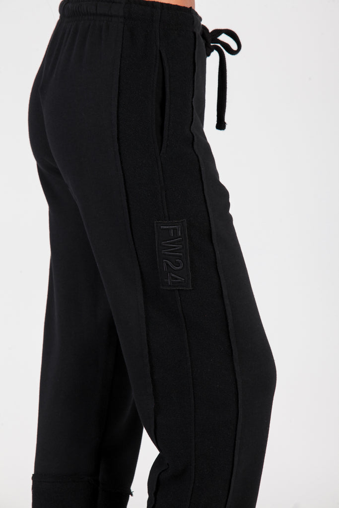 Jogger cortes desiguales negro